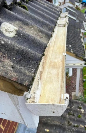 The same run of gutter cleared and clean